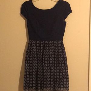 A blue dress with a red, white, and yellow design!